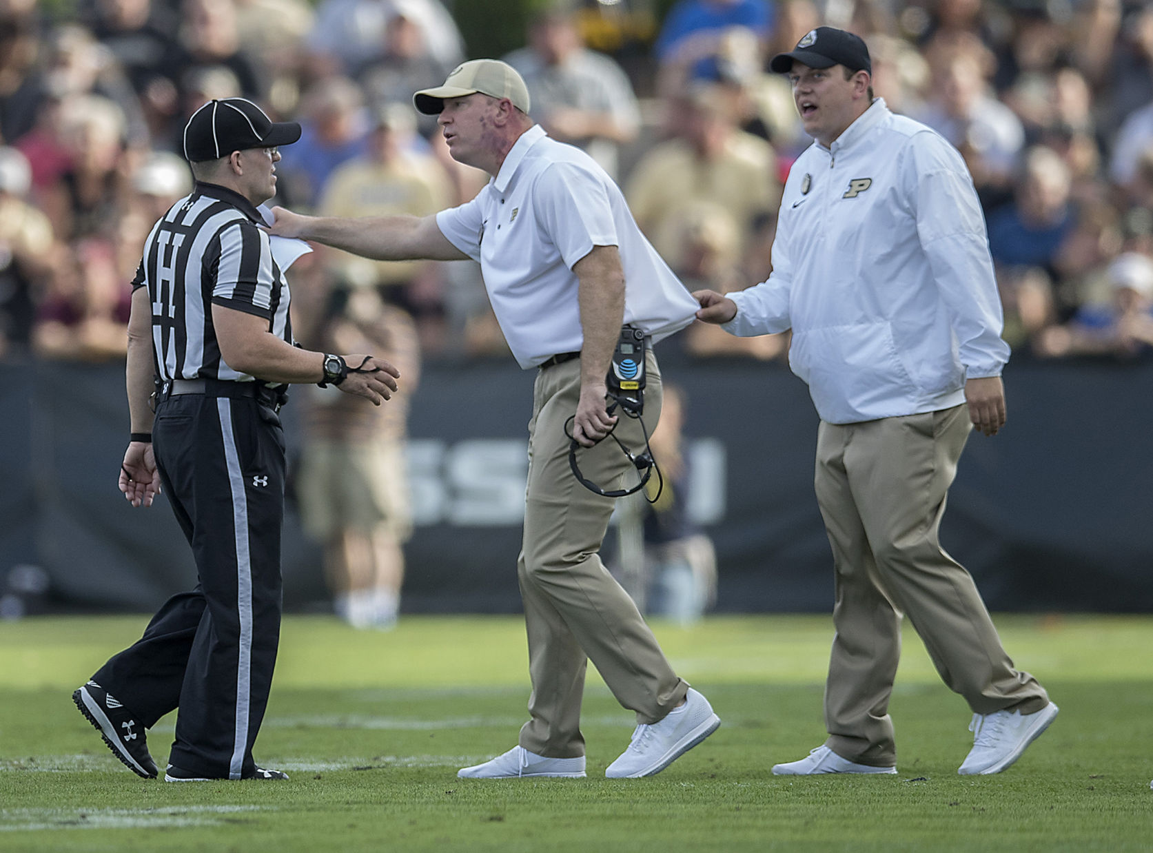 Purdue head coach Jeff Brohm argues a call with the referees during the second quarter against Minnesota at Ross-Ade Stadium in West Lafayette, Ind., on Saturday, Oct. 7, 2017.